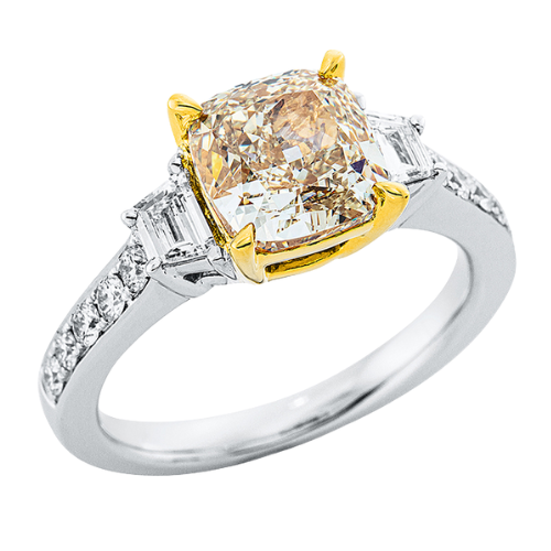 Diamond ring with yellow center stone in white and yellow gold